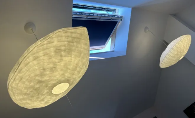 Pose de luminaires dans un salon à Ruy-Montceau